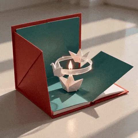 cute paper crane birthday GIF — paper cranes circling a candle inside an open red-and-teal birthday card