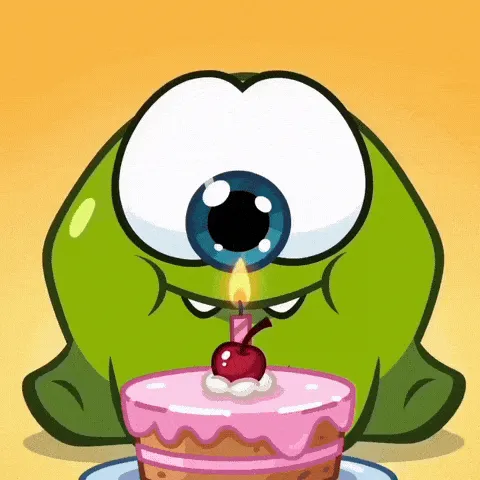 cyclops inhale happy birthday GIF — green one-eyed cartoon creature leaning toward a pink birthday cake