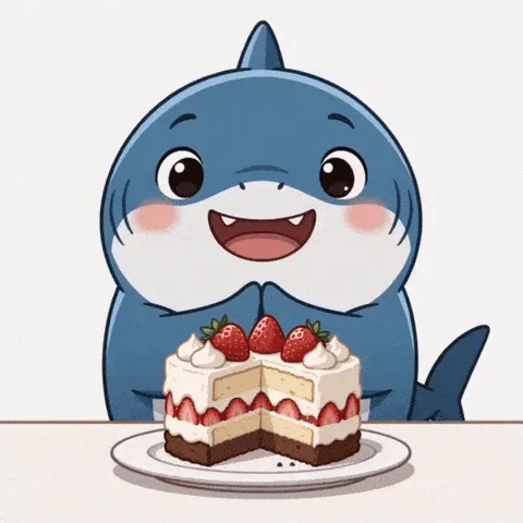 shark bite happy birthday GIF — smiling blue cartoon shark behind a strawberry-topped layer cake